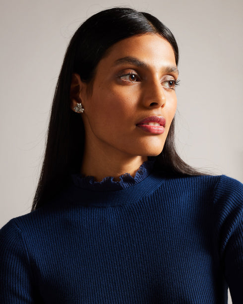 DVANA-Knitwear-For a frilling addition to your smart-casual wardrobe, add DVANA to your style repertoire. Not any ordinary knit, this ribbed jumper is given a little extra in the form of a frill detailing on the neckline and sleeves. Fitted jumper Cashmere blend High neck Long sleeves Frilled trims Ribbed knit- Ted Baker Romania